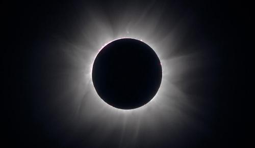 A composite of several images showing the solar corona at the total solar eclipse of 2013 from Mikongo, Gabon. (Courtesy of Allen B. Davis and Mike Kentrianakis) image of solar eclipse